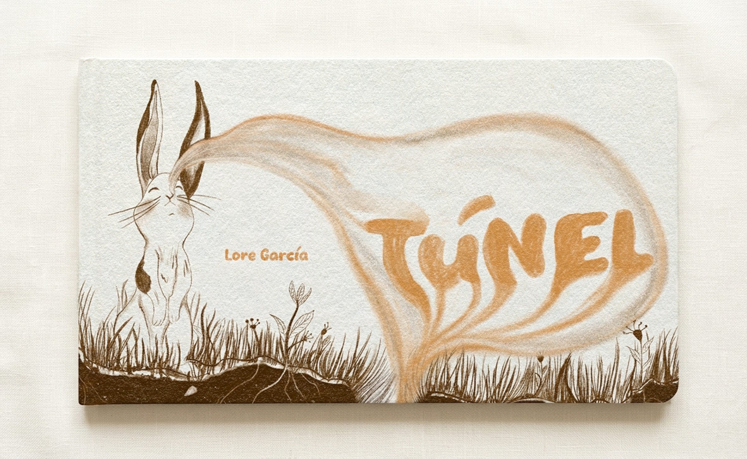 The closed book: front cover with a rabbit and the title Túnel rising like smoke